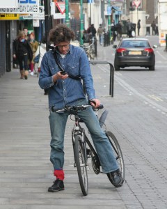 bicyclist-texting-in-street-for-site